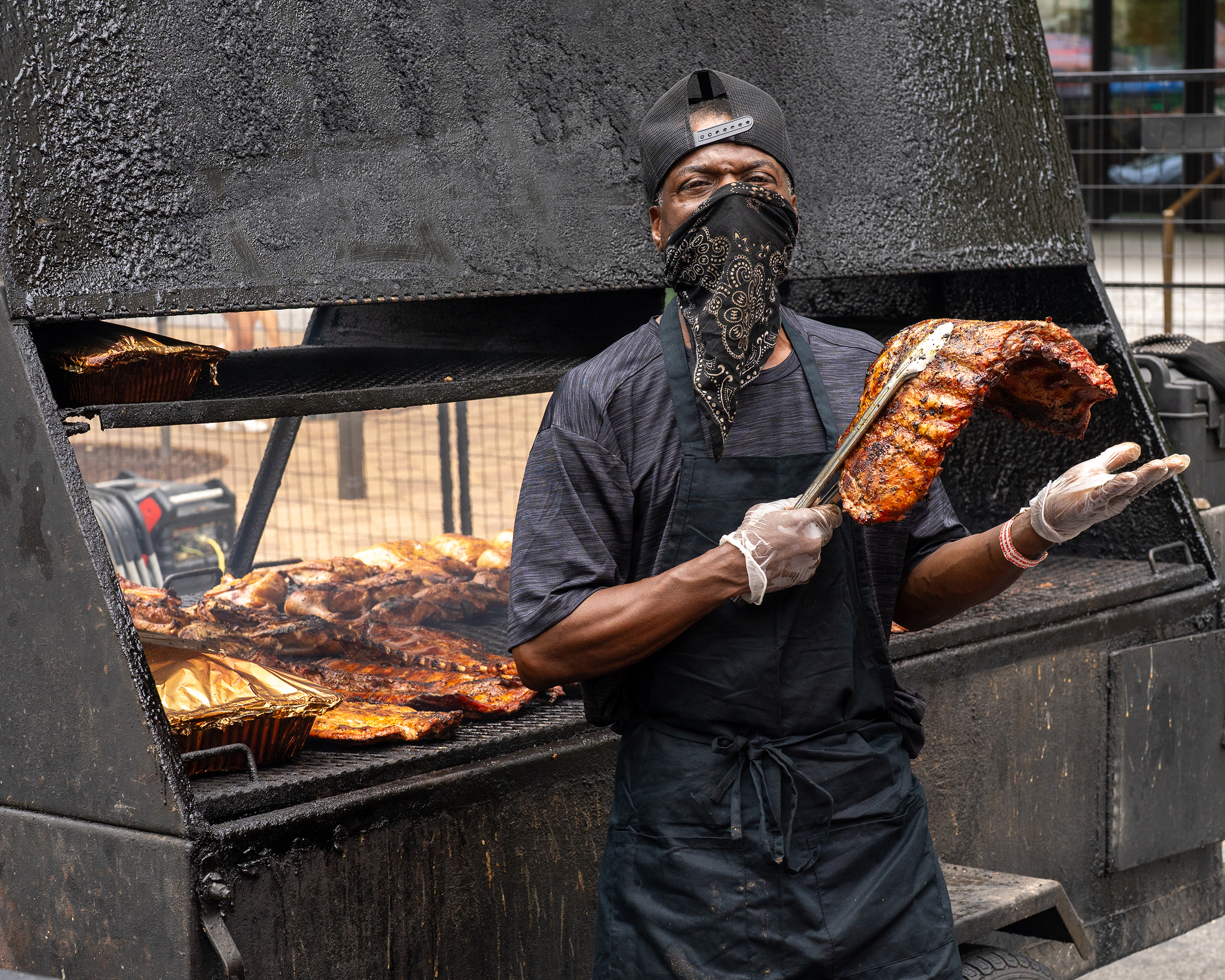 BBQ Chef posing with a rack of ribs at the DC BBQ Battle