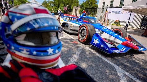 Indy car and helmet at the Freedom 250 Grand Prix