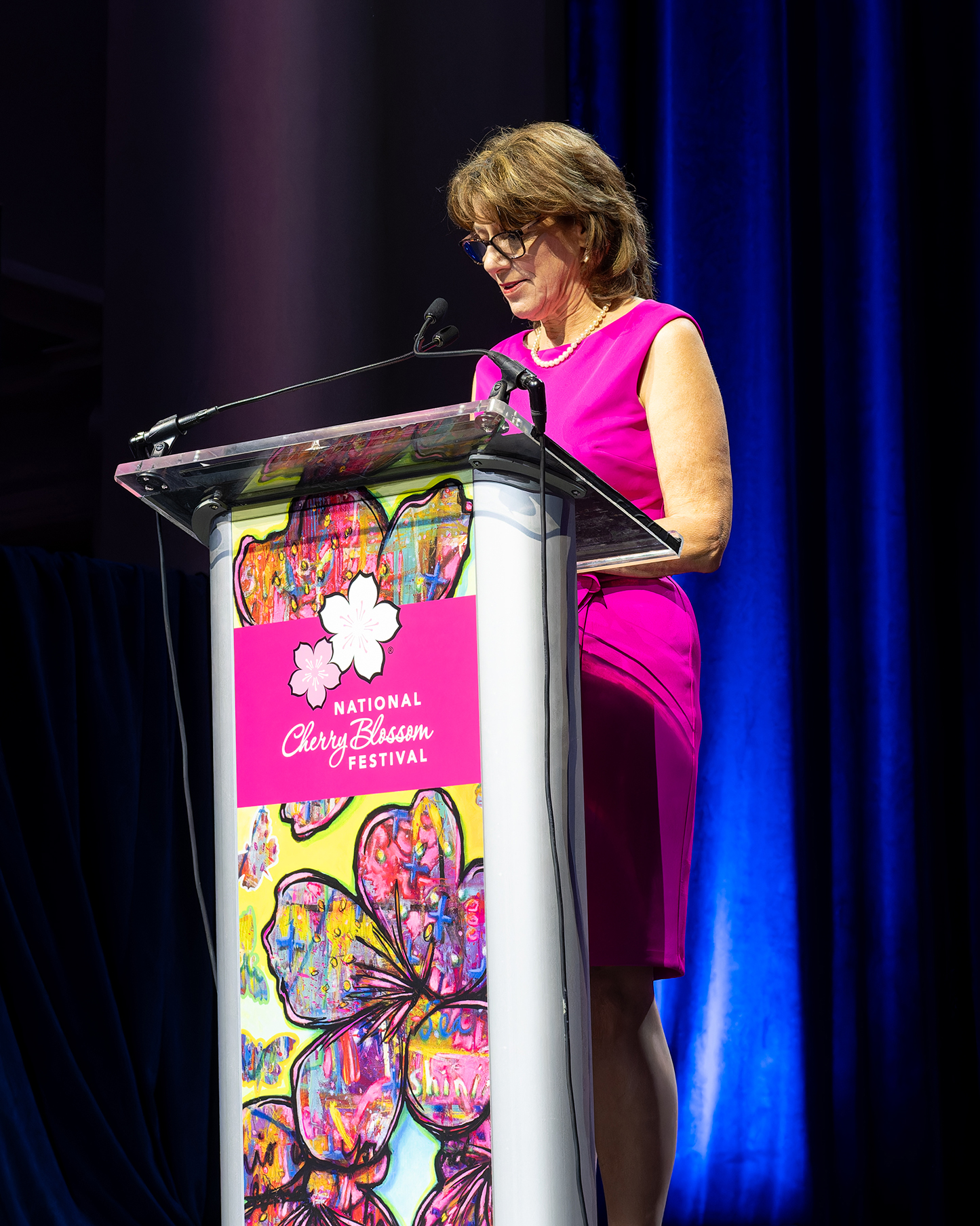 Diana Mayhew in a pink spring dress.