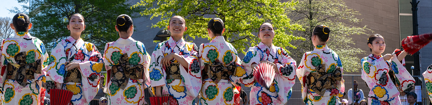 Crowds, performers, and cultural exhibits at Sakura Matsuri in Washington, DC