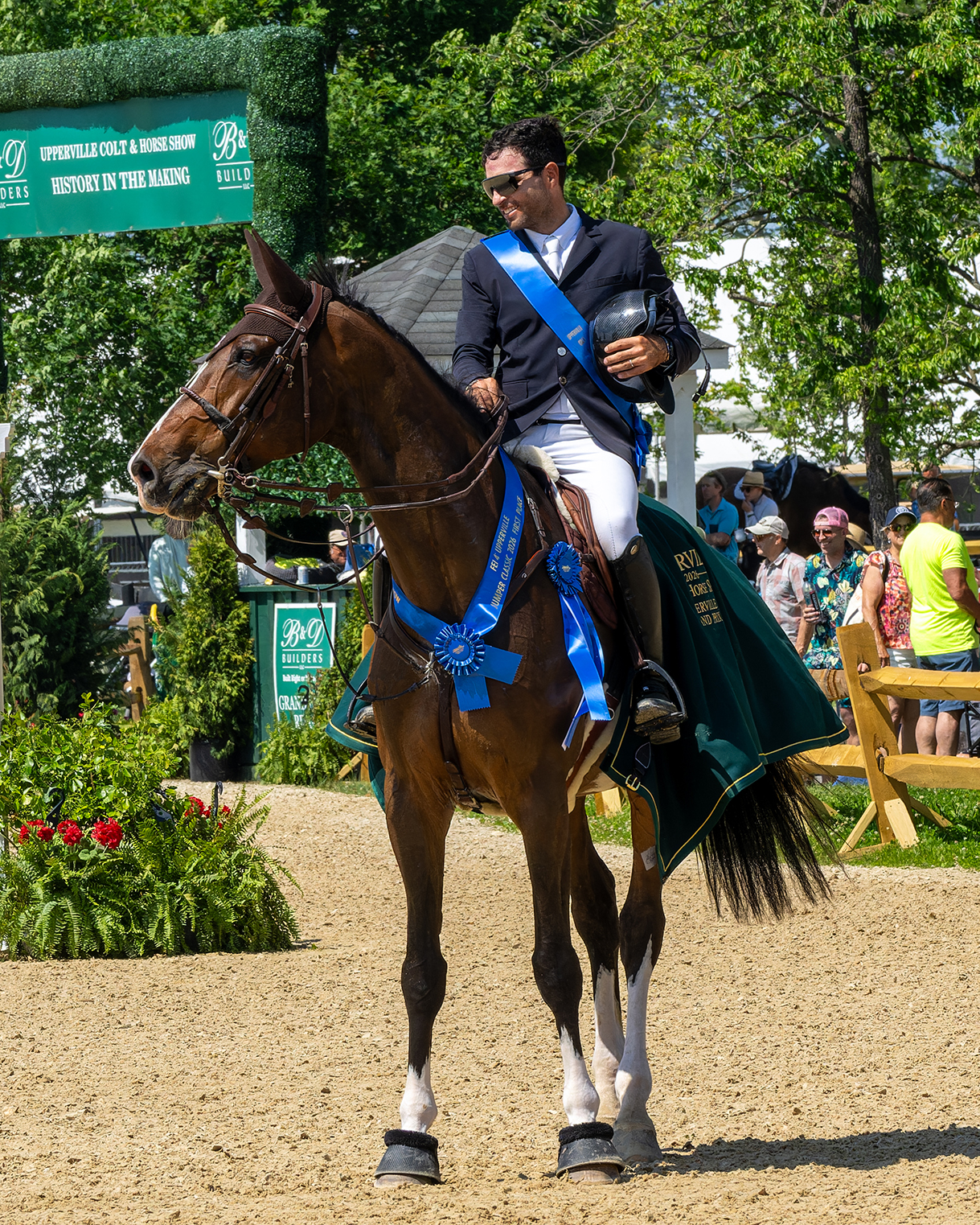 Daniel Bluman and Hummer Z celebrating their first-place victory at the 2026 Upperville Jumper Classic.