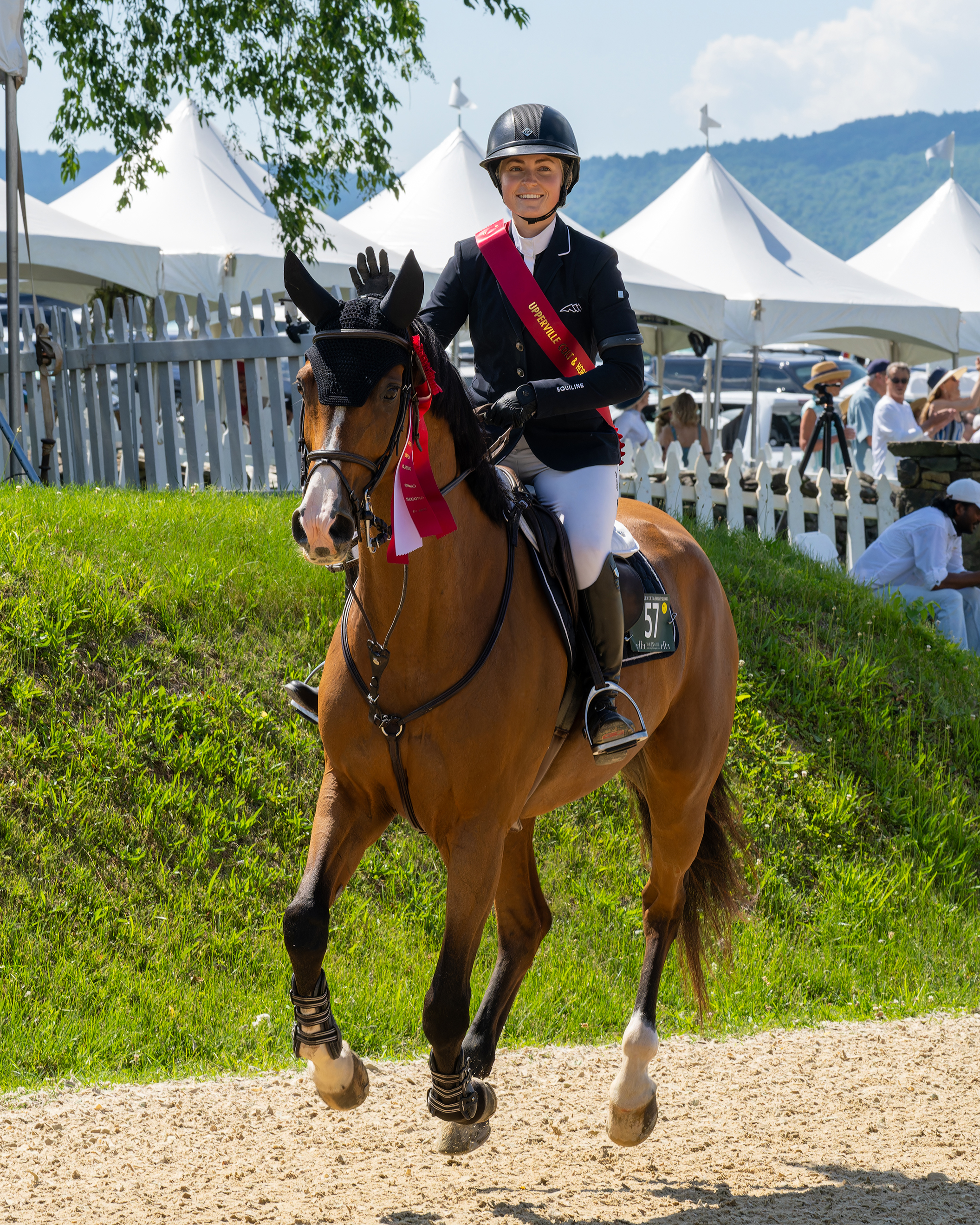Chloe Reid and Crossover 4 celebrating their second-place finish at the 2026 Upperville Jumper Classic.